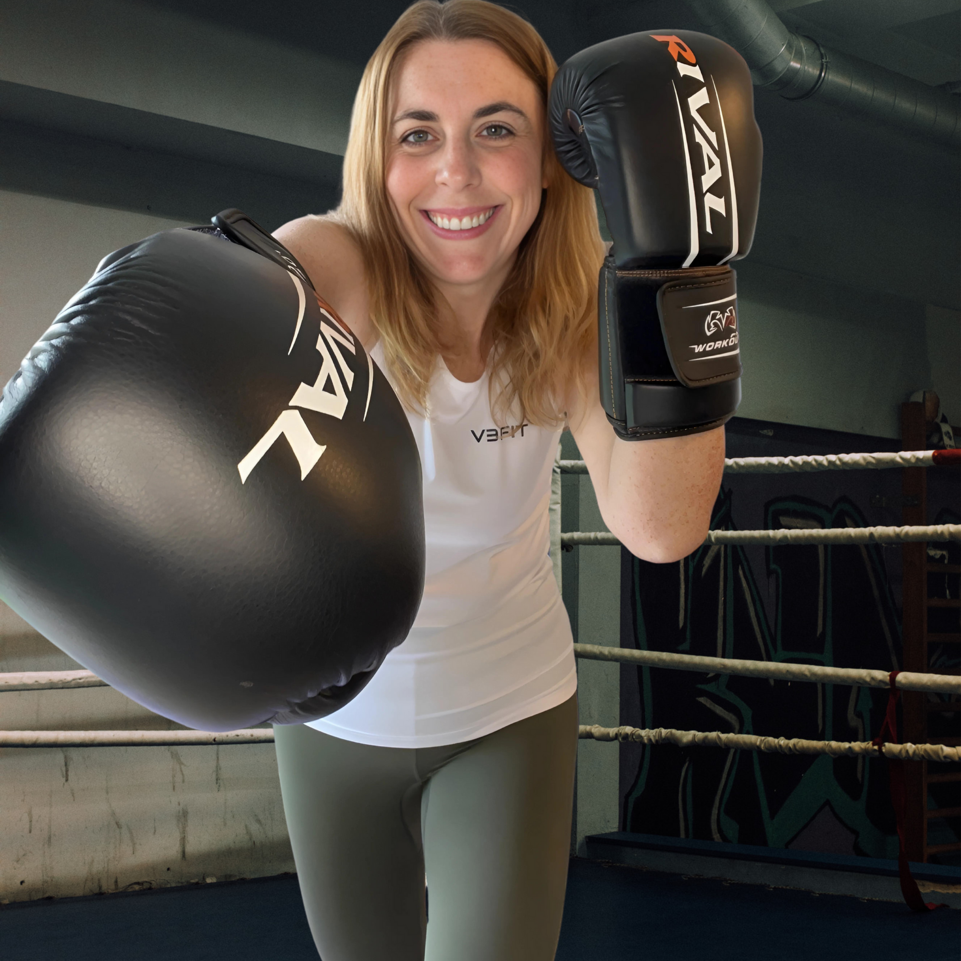 A photograph depicts a healthy woman, attired in sustainable gym leggings and a vest, wearing boxing gloves during a fitness session.